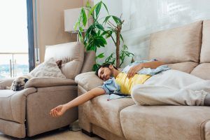 young-man-sleeping-sofa_181624-27192