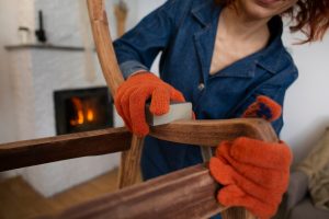front-view-woman-restoring-wooden-furniture_23-2150232713